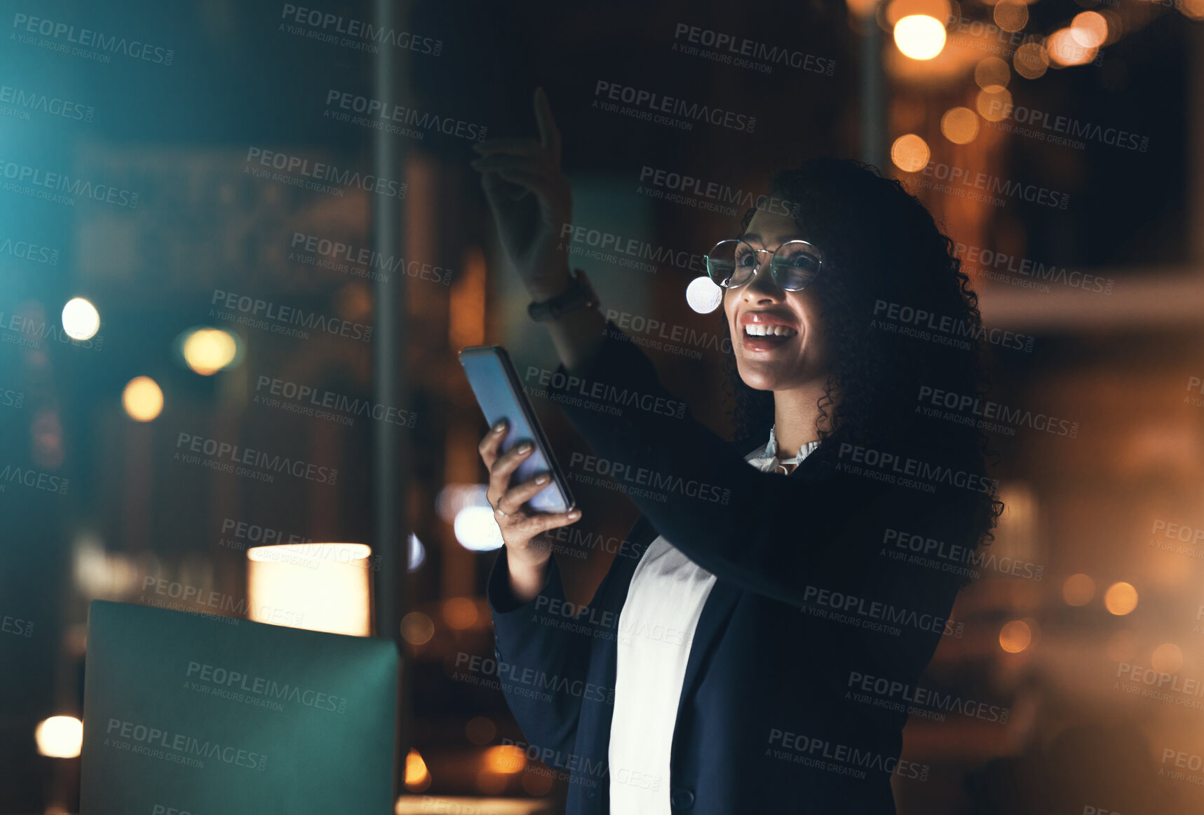 Buy stock photo Business woman, phone and night in the office with bokeh lights to work late for project deadline. African American female employee working overtime with smartphone technology in a dark workplace