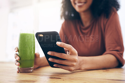 Buy stock photo Green smoothie, smartphone and woman detox, healthy breakfast or diet inspiration on internet, blog or social media. Young person hand holding phone and juice, vegan or fruit drink for nutrition