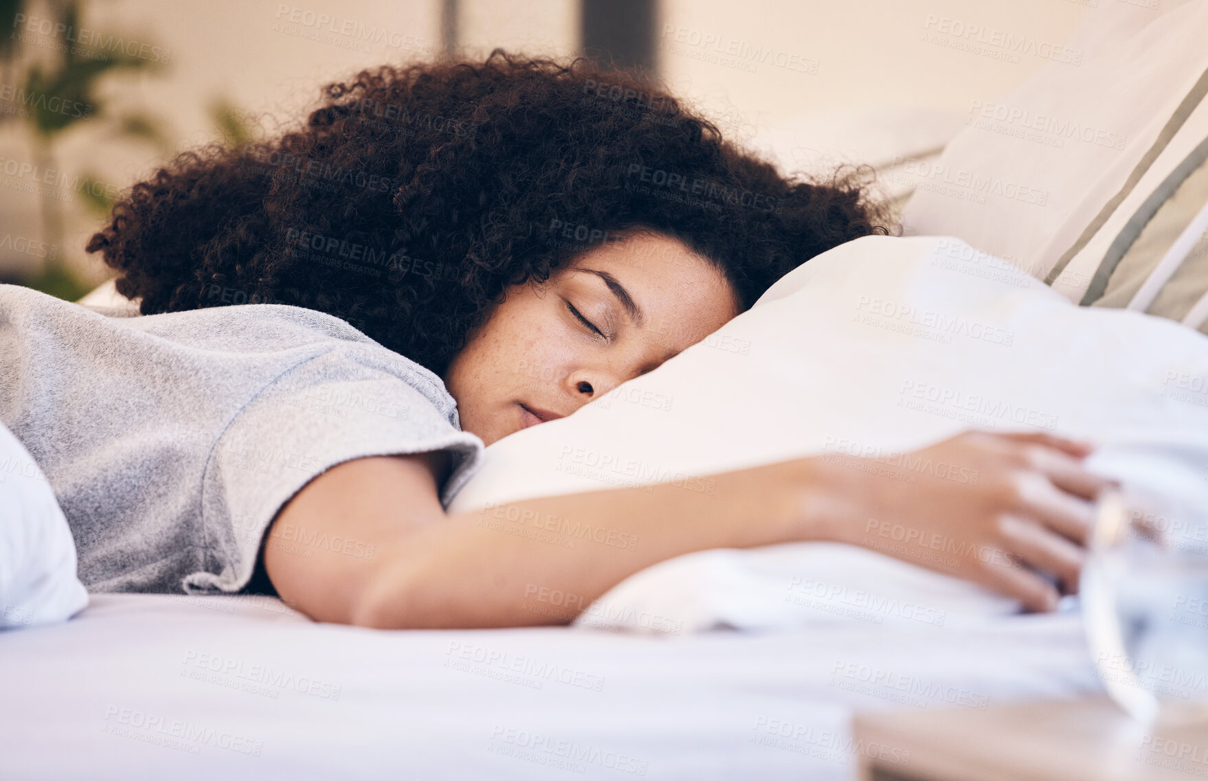 Buy stock photo Black woman, sleeping and bed in morning for peace, quiet and rest or relax in home bedroom. Person with pillow to dream or for calm sleep with insomnia or fatigue therapy for health and wellness