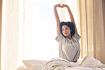 Black woman, wake up and morning stretching in home bedroom after sleeping or resting. Bed relax, peace and comfort of young female stretch after feeling fresh, awake ready to start day in house.