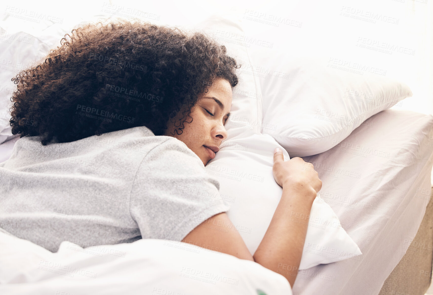 Buy stock photo Sleeping, comfortable and black woman in bed for rest, relax and stress relief. Night, nap and African girl lying in a bedroom while tired with fatigue, pillow and blanket while dreaming and resting