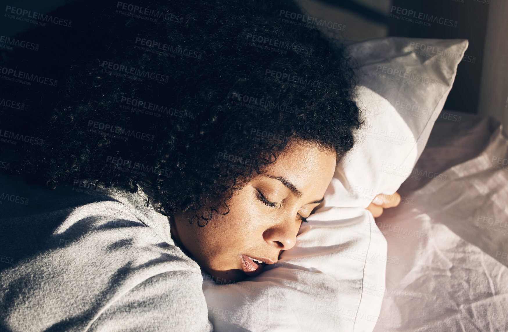 Buy stock photo Sleep, black woman and bed in morning for peace, quiet and rest or relax in home bedroom. Person face on pillow to dream or for calm sleeping with insomnia or fatigue therapy for health and wellness