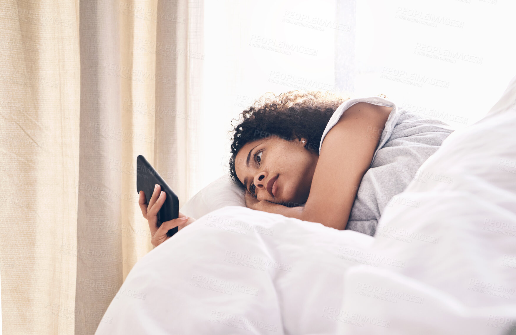 Buy stock photo Bed, black woman and typing on phone in home bedroom for social media, texting or internet browsing in the morning. Technology, relax and female with mobile smartphone for web scrolling or networking