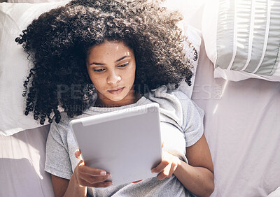 Buy stock photo Black woman, tablet and top view in bed in bedroom for social media, texting or internet browsing in the morning. Technology, relax and female on digital touchscreen for web scrolling or networking.