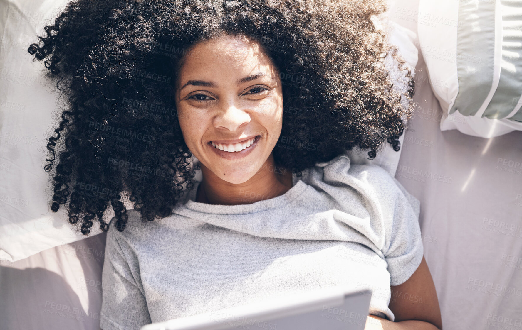 Buy stock photo Black woman, tablet and top view in bed in bedroom for social media, texting or internet browsing in the morning. Portrait, relax and female on digital touchscreen for web scrolling or networking.