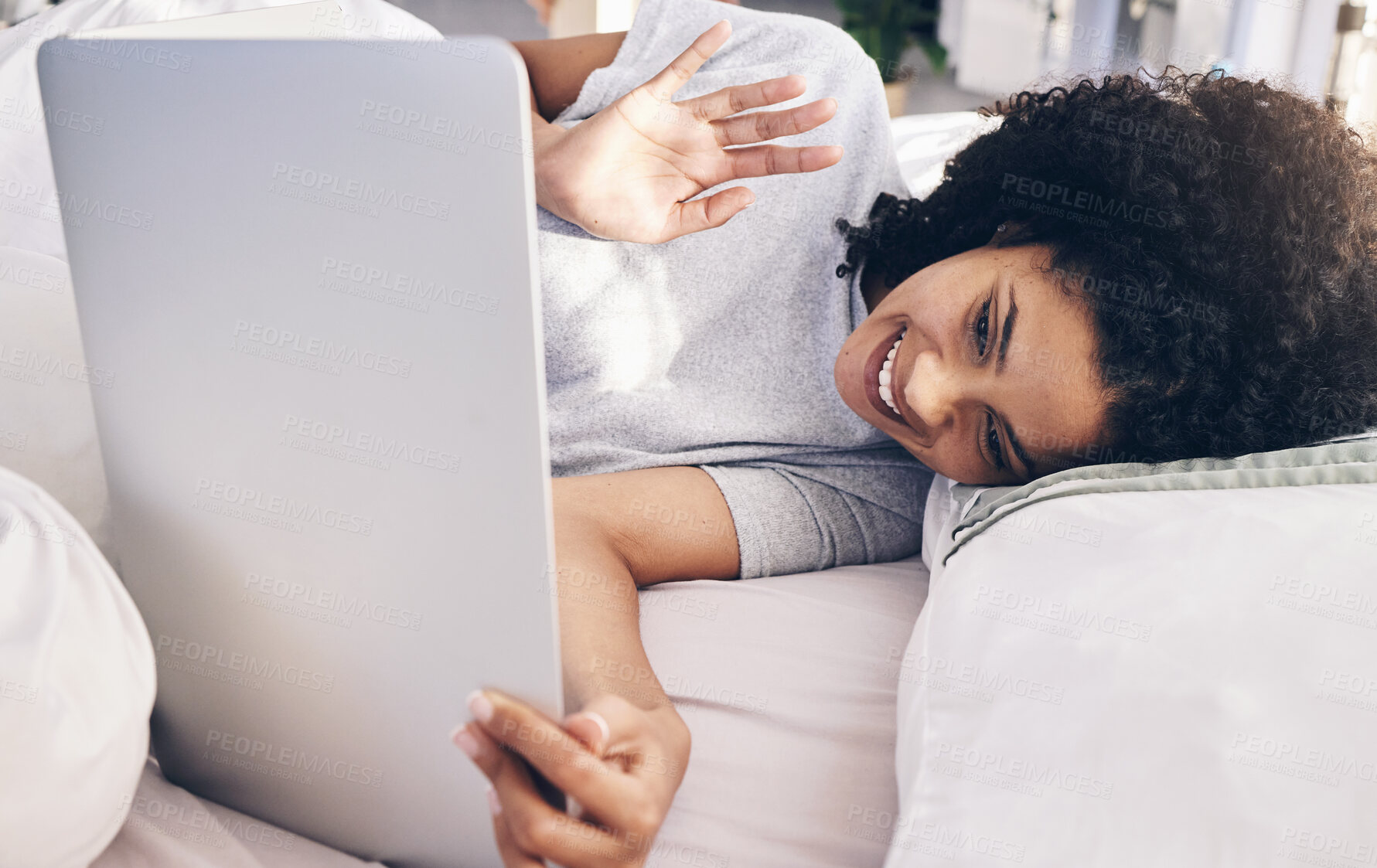 Buy stock photo Video call, laptop and woman wave in bed in bedroom for online chat in the morning. Technology, communication and black female waving on virtual conference while talking to contact with computer.