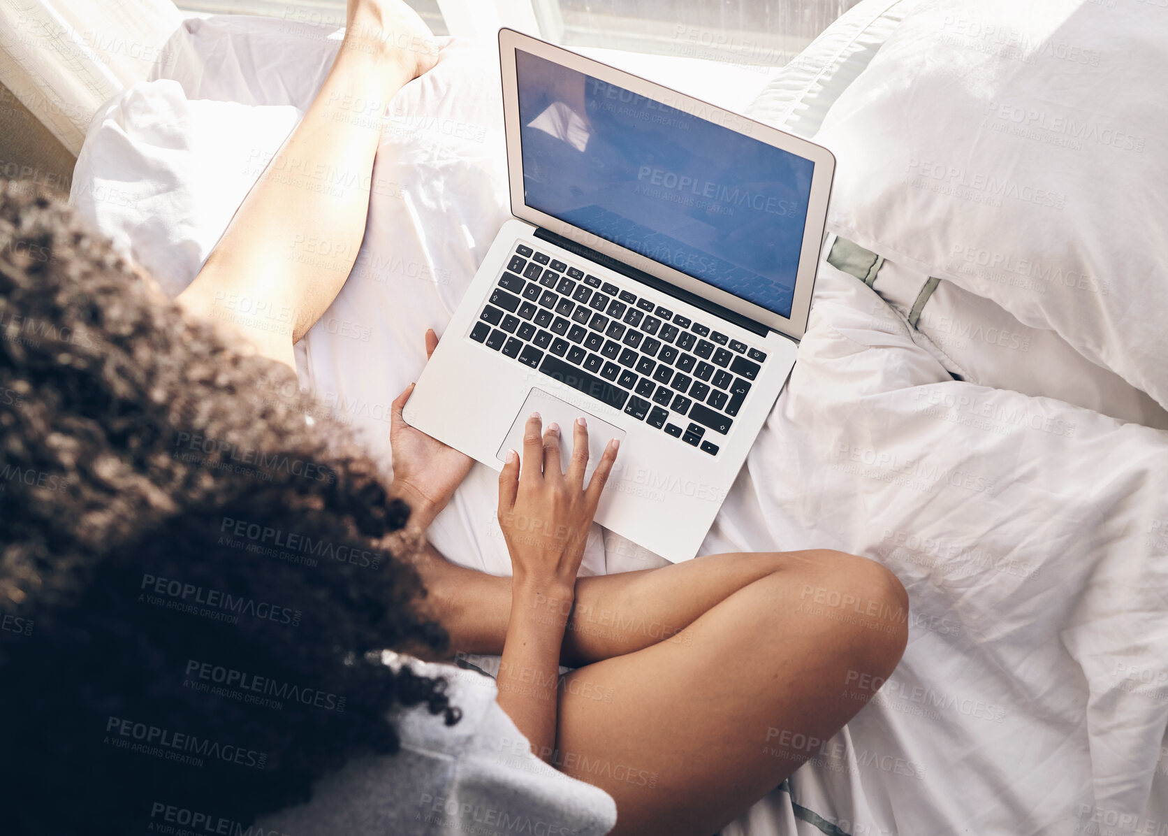 Buy stock photo Top view, bed and woman browsing on a laptop for social media or the internet in the morning. Technology, bedroom and female remote freelancer working on a freelance project on a computer at home.