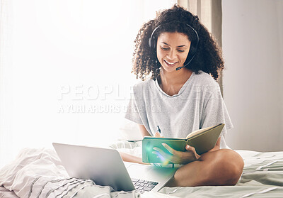 Buy stock photo Black woman, laptop and writing notes on bed in remote work for consulting, telemarketing or sales at home. Happy African American female freelancer agent with headset and computer working in bedroom