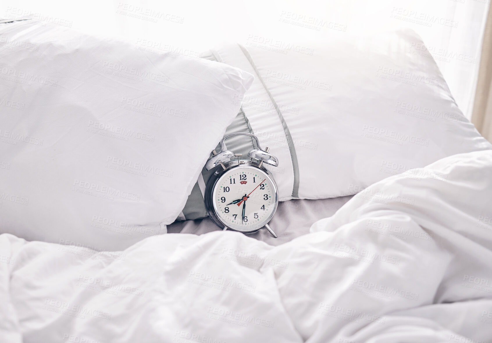 Buy stock photo Time, waking up and alarm clock on a bed with no people for punctual, sleeping and hour management. Empty, bedroom and vintage timer for routine, sleep and rest schedule, snooze and resting on mockup