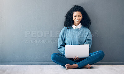 Buy stock photo Laptop, happy and research with black woman on floor for social media, news and designer on wall mockup. Website, online shopping and technology with girl for communication, internet and advertising