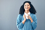 Black woman, portrait and coffee drink in studio, background and mockup backdrop. Happy young african female model smile with cup of tea, cappuccino and mug of latte beverage, happiness and mock up