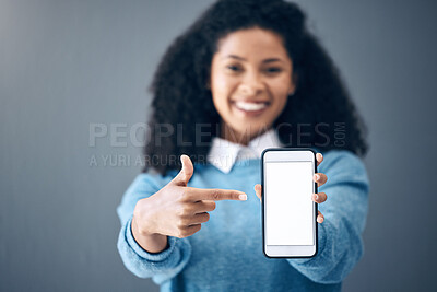 Buy stock photo Mockup, phone screen or black woman pointing hand at digital marketing, branding or advertising content. Startup, web or girl in studio with smartphone for product space, internet or social media 