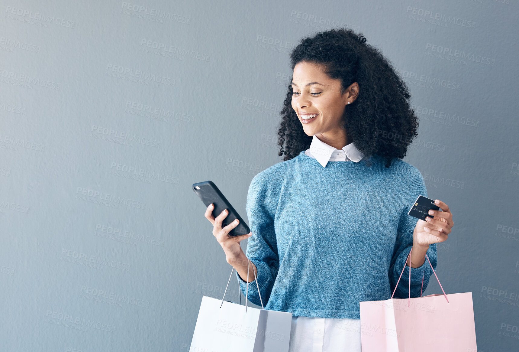 Buy stock photo Mockup, credit card and black woman with smartphone, shopping bags and ecommerce on grey studio background. African American female customer, lady and shopper with cellphone, boutique items or retail