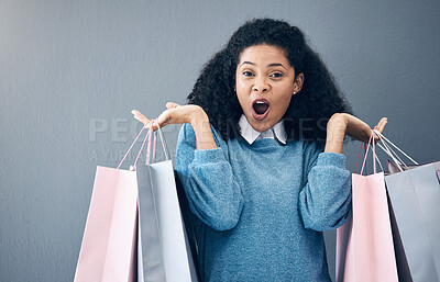 Buy stock photo Wow, discount and portrait of woman with shopping bags, retail therapy and surprise at sale on wall. Deal, excited and happy girl holding products from a shop, market or mall on a background
