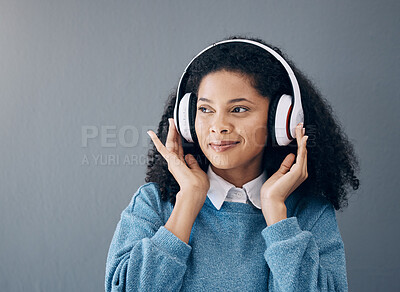 Buy stock photo Music, relax and black woman in studio with peace, streaming or good mood on grey background. Radio, podcast and girl with positive, mindset or audio, online or playlist on advertising isolated space