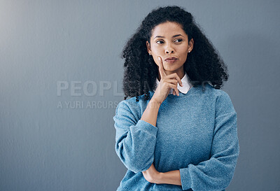 Buy stock photo Thinking, thoughtful and woman in a studio with an idea, smart question or plan in her head. Contemplating, pensive and doubtful female model from Mexico isolated by gray background with mockup space