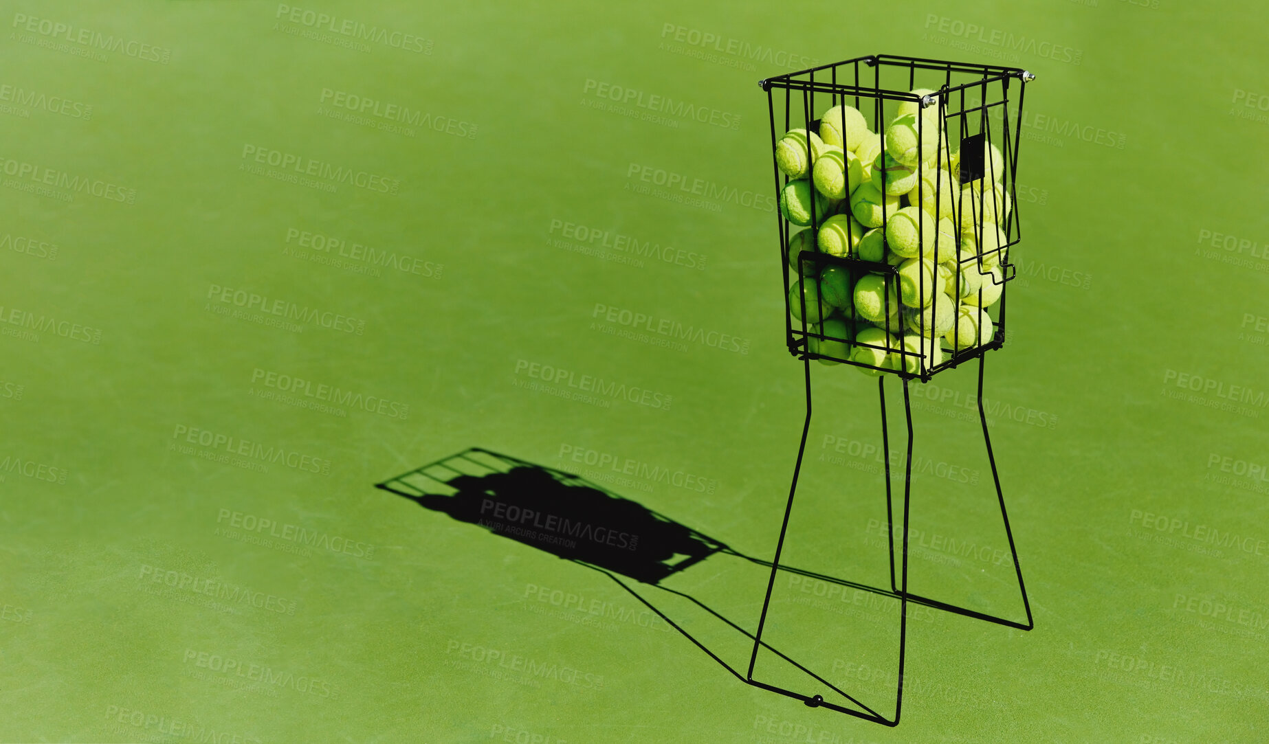 Buy stock photo Tennis, sport ball basket of sports field on a green training court outdoor with no people. Exercise, fitness and workout equipment shadow for match of game competition on turf ground with mockup