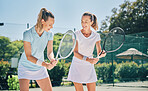 Tennis, sport and women with athlete and coach on outdoor turf, training instructor with fitness motivation and help. Exercise, sports lesson and workout together, teaching and learn skill on court