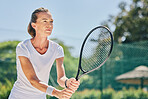 Senior woman, tennis player and ready in sports game for ball, match or hobby on the court. Happy elderly female in sport fitness holding racket smiling in stance for training or practice outdoors