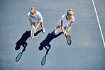 Woman, tennis and friends in team match, game or sports together standing ready above on the court. Women in fitness sport, competition or club with racket stance for teamwork, exercise or training