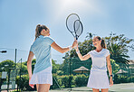 Tennis, racket high five and women teamwork for sport game outdoor for exercise and fitness. Sports achievement, winner and happy athlete partner team feeling success from workout goals on court