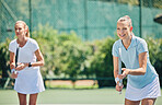 Women, sports and tennis on outdoor court for fitness, exercise and training for competition. Happy people at club for team game, workout and performance for health and wellness with summer cardio
