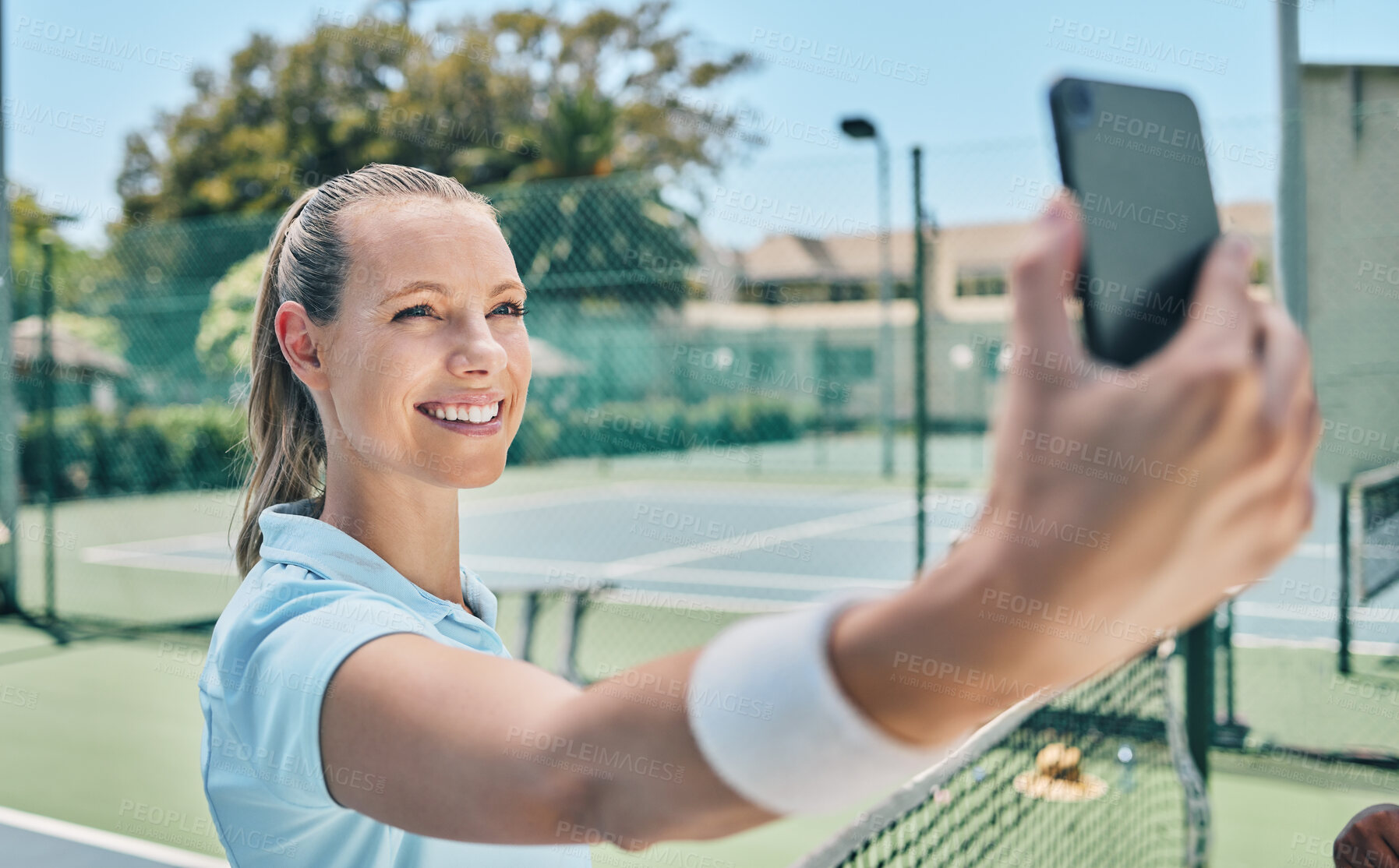 Buy stock photo Woman, tennis and selfie at court during training, fitness and morning routine outdoors. Sports, girl and smartphone photo before match, performance or exercise, workout and smile for profile picture