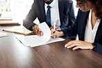 Lawyer, hands and contract with a business team at a desk in an office to sign documents. Teamwork, meeting or financial advisor with a man and woman employee signing paperwork in agreement of a deal