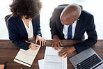 Lawyer, consulting and documents with a business team working on a desk in an office from above. Contract, meeting or financial advisor with a man and woman employee at work in collaboration