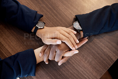 Buy stock photo Couple, love and above hands of comfort in support of bad news, cancer or diagnosis at table, unity or trust. Hand, holding empathy by woman with man for depression, prayer and kindness during crisis