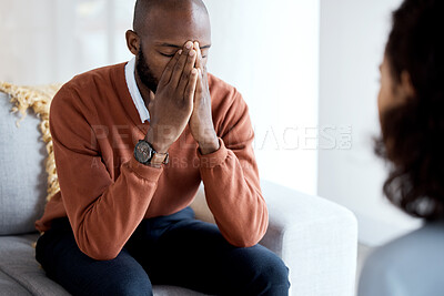 Buy stock photo Black man, mental health and depression counseling and psychologist, stress headache and help. Psychology consultation, woman doctor with depressed patient and conversation about anxiety problem