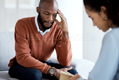 Buy stock photo Black man, mental health and therapy with woman psychologist, stress headache and depression with help. Consultation, doctor with patient and conversation about anxiety problem, sad and depressed