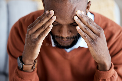 Buy stock photo Headache, stress and sad with black man on sofa for burnout, mental health and anxiety. Depression, thinking and frustrated with guy in living room suffering with problem, worried and exhausted  