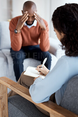 Woman psychologist writing, black man in therapy with mental health, stress headache and depressed with help. Consultation, doctor report on patient diagnosis, anxiety problem and sad with depression