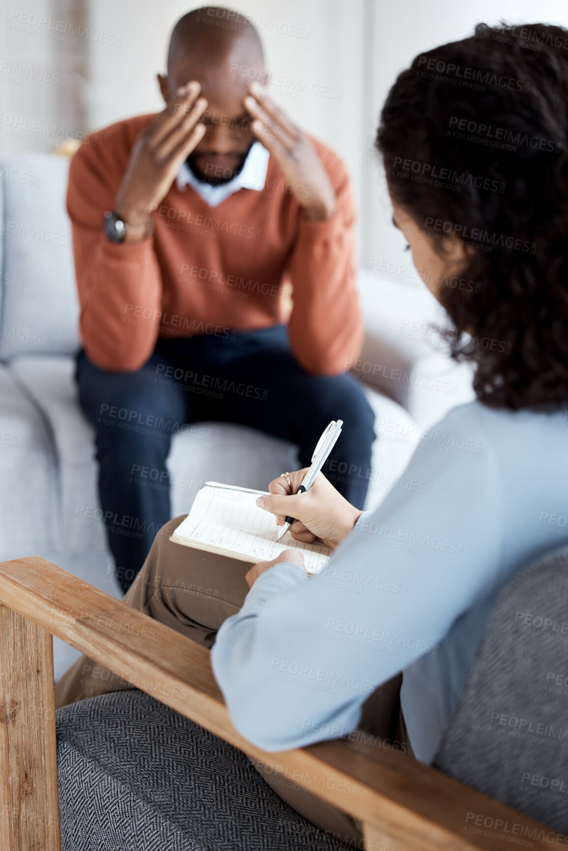 Buy stock photo Woman psychologist writing, black man in therapy with mental health, stress headache and depressed with help. Consultation, doctor report on patient diagnosis, anxiety problem and sad with depression