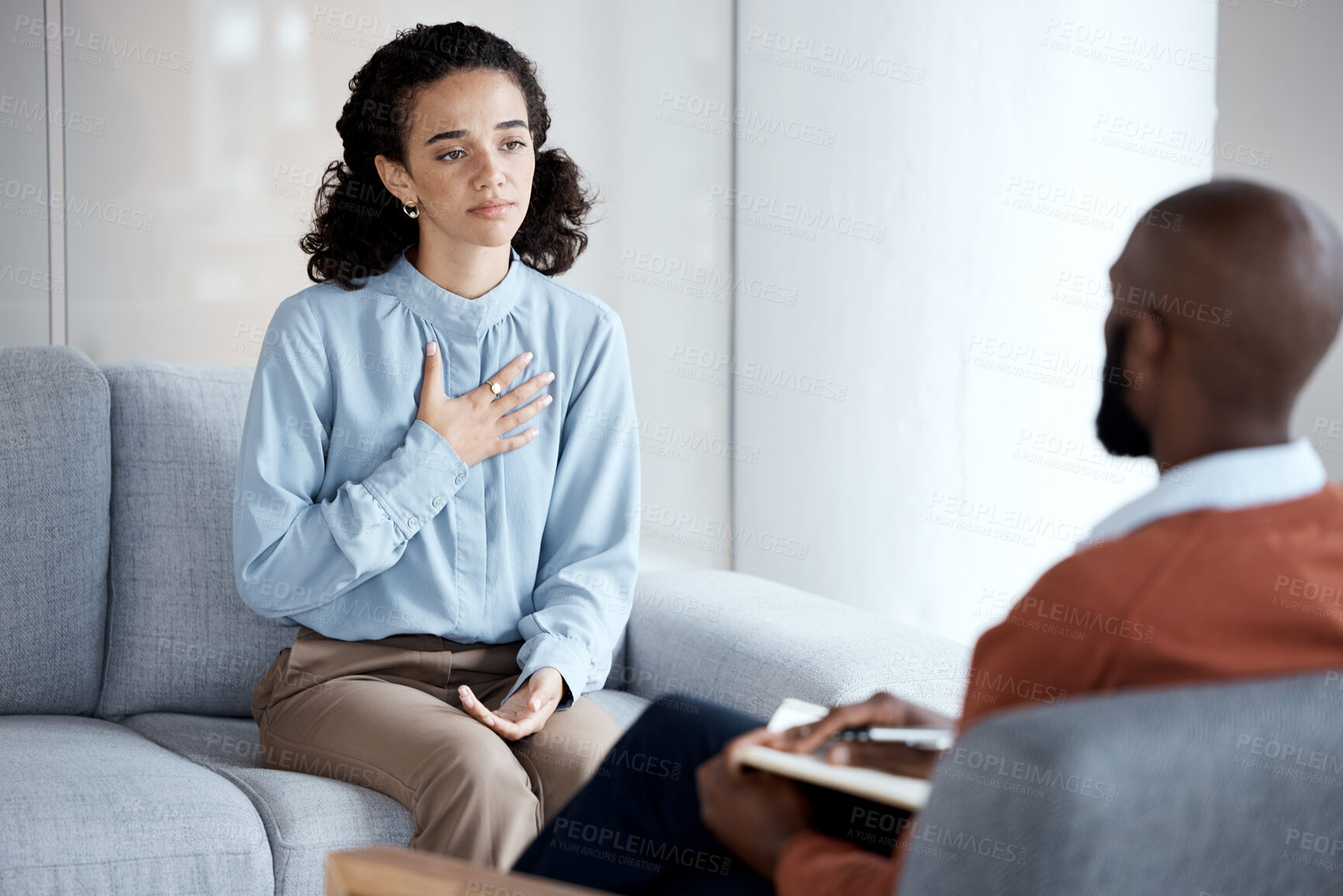 Buy stock photo Conversation, sad and woman with a psychologist for therapy, trauma and mental health support. Consultation, psychology and patient talking to a black man during counseling about a life problem