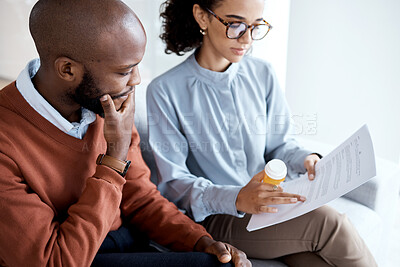 Buy stock photo Therapy, mental health pills and man with depression, trauma or stress on psychologist couch. Person talking to woman therapist for psychology and anxiety prescription document for help or support