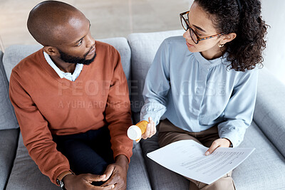 Buy stock photo Mental health, therapy and pills for patient with depression, trauma or stress with psychologist. Man talking to woman therapist for psychology and anxiety medicine and paper for help or support