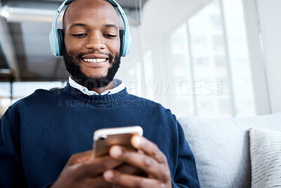 Buy stock photo Black man with smartphone, headphones and face, music and smile, scroll social media and audio streaming. Online, listening to radio or podcast with happiness and relax with texting or email