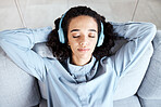 Woman face, relax and headphones for listening to music for calm, peace and mindfulness. Young person on living room sofa listen to podcast, audio or motivation for meditation above home couch