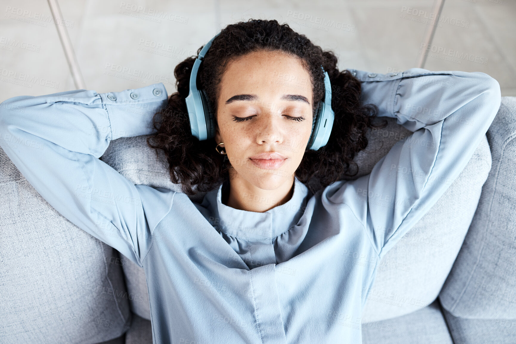 Buy stock photo Woman face, relax and headphones for listening to music for calm, peace and mindfulness. Young person on living room sofa listen to podcast, audio or motivation for meditation above home couch