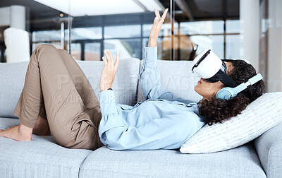 Buy stock photo Virtual reality, metaverse and gamer with a black woman on a sofa in the living room of her home. AI, 3D and VR with a young female gaming using a headset to access cyberspace for a video game