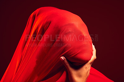 Buy stock photo Model, red fabric and hidden face for fashion, aesthetic and beauty by dark studio background. Gen z woman, cloth or silk veil for creativity, design and art with retro, vintage or creative clothes