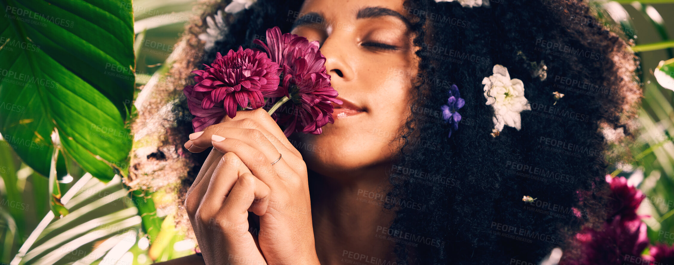 Buy stock photo Flowers, beauty and scent by woman in studio for wellness, skincare and creative advertising in jungle. Face, skin and girl model relax in zen, peace and product from nature, forest and aesthetic