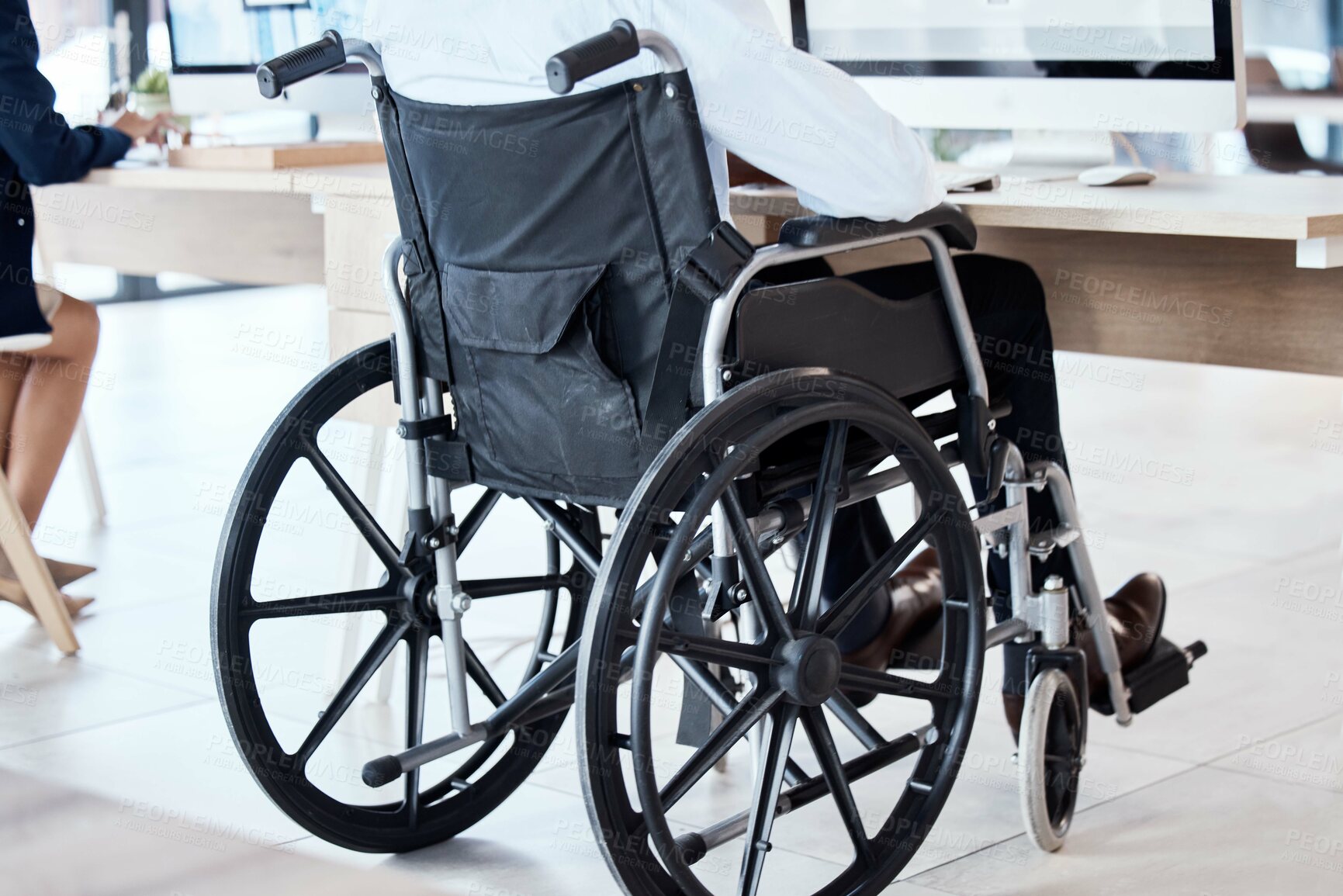 Buy stock photo Wheelchair, office and business man disability in the workplace doing administrative assistant work. Working, computer and desk job of a worker back with technology in a coworking space with staff