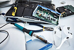 Tools, computer hardware and equipment in the office for tech repairs, maintenance or upgrade. Database, technology and supplies for electric board servers on a desk in the it industry workplace.