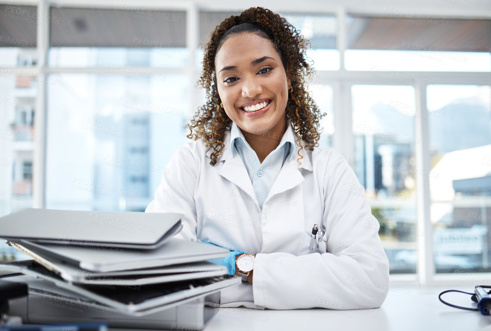 Buy stock photo Doctor, documents and portrait of healthcare professional with paperwork on desk or table in the office smile and happy. Medical, research and medicine student studying and learning for knowledge