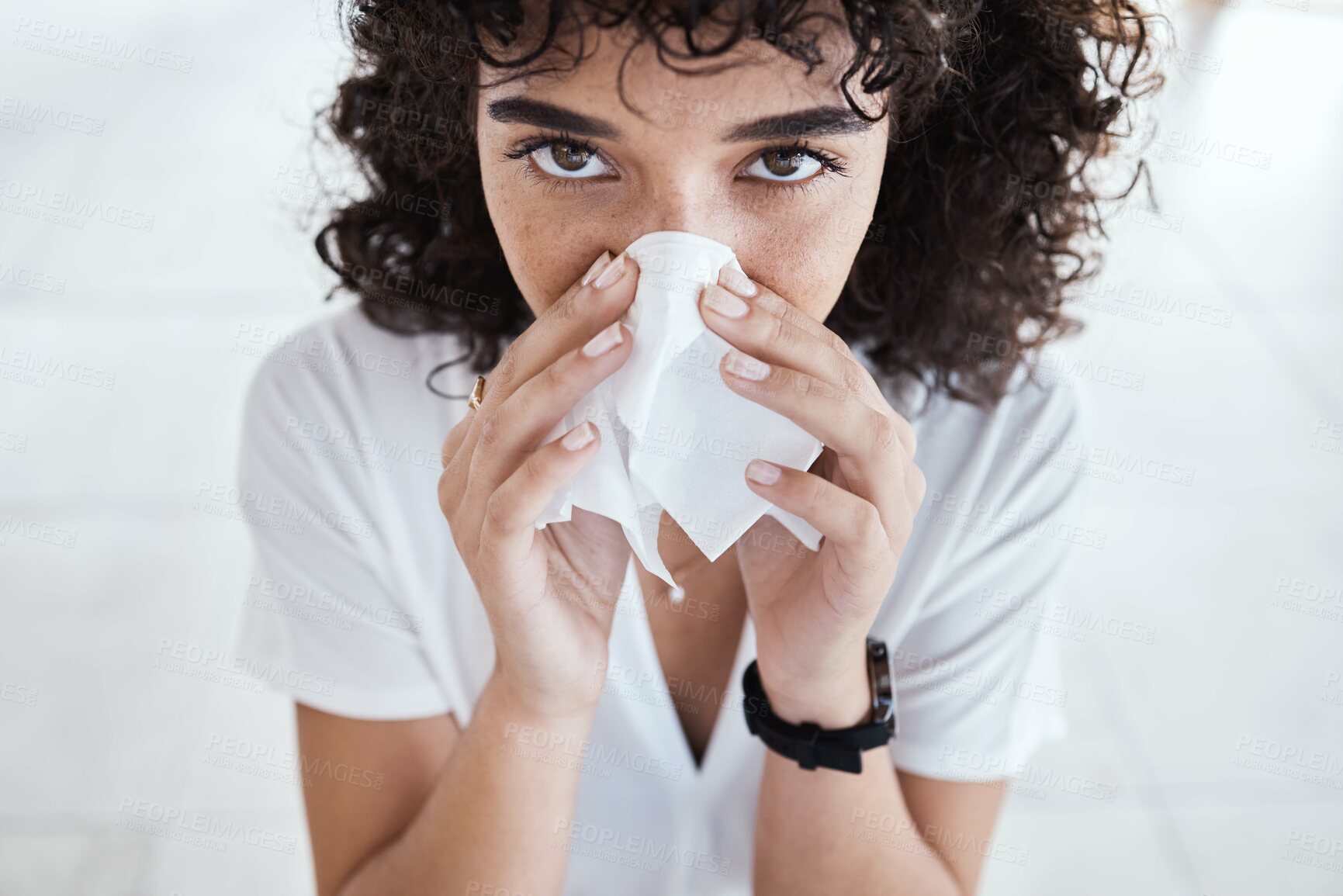 Buy stock photo Black woman, tissue and blowing nose in home for portrait with allergies, sneeze and blurred background. Gen z girl, toilet paper and sick with allergy, covid and closeup in house, apartment or room