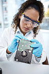 Computer hardware, inspection and black woman electrician with electronic cpu, circuit and microchip. Technology maintenance, programming and female technician fix coding, motherboard and processor