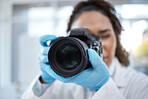Camera, photography and lens with black woman in forensics laboratory for investigation, crime scene and evidence.  Research, analytics and observation with girl and digital pictures for science
